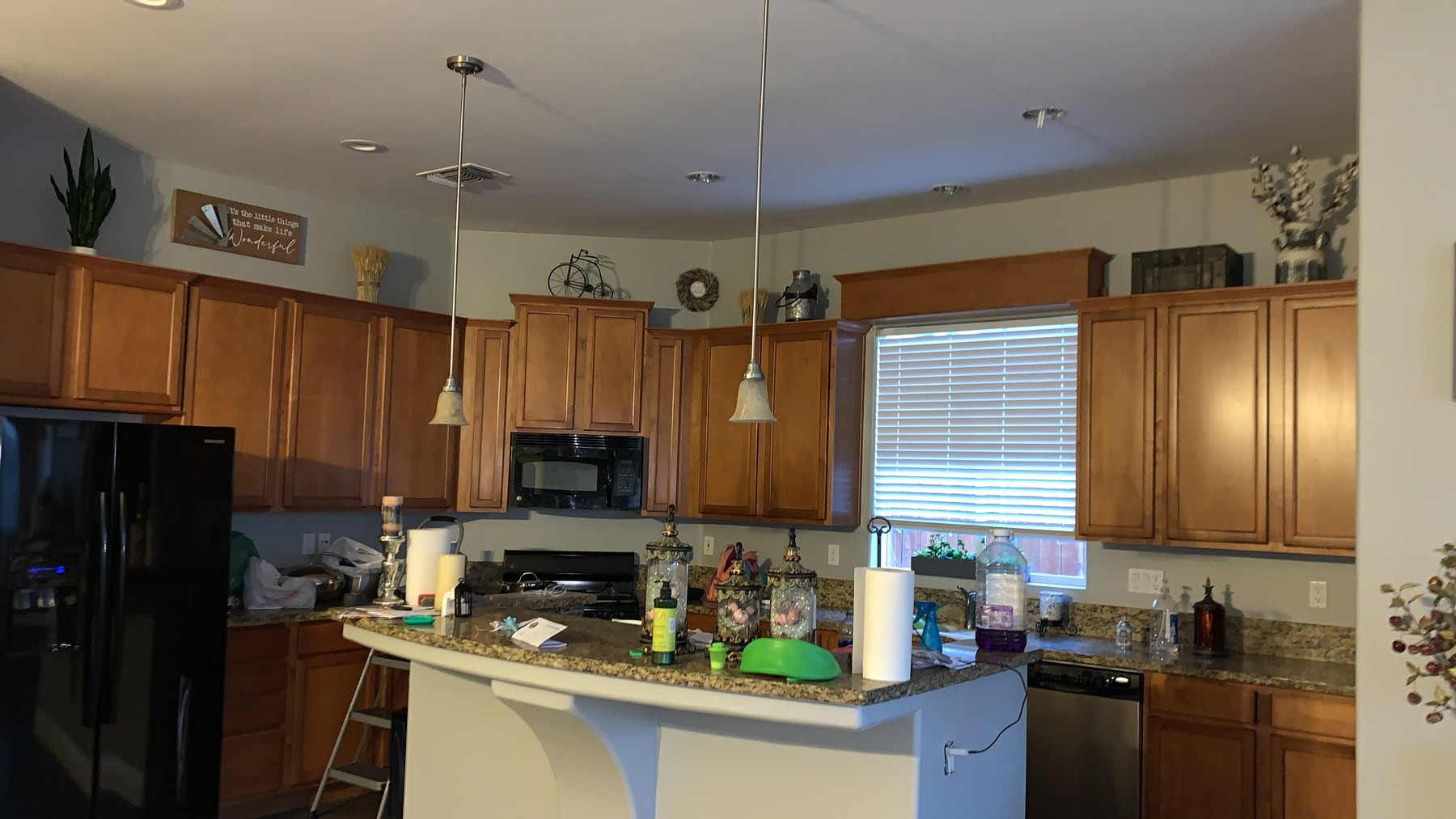 Kitchen before — dated granite countertops