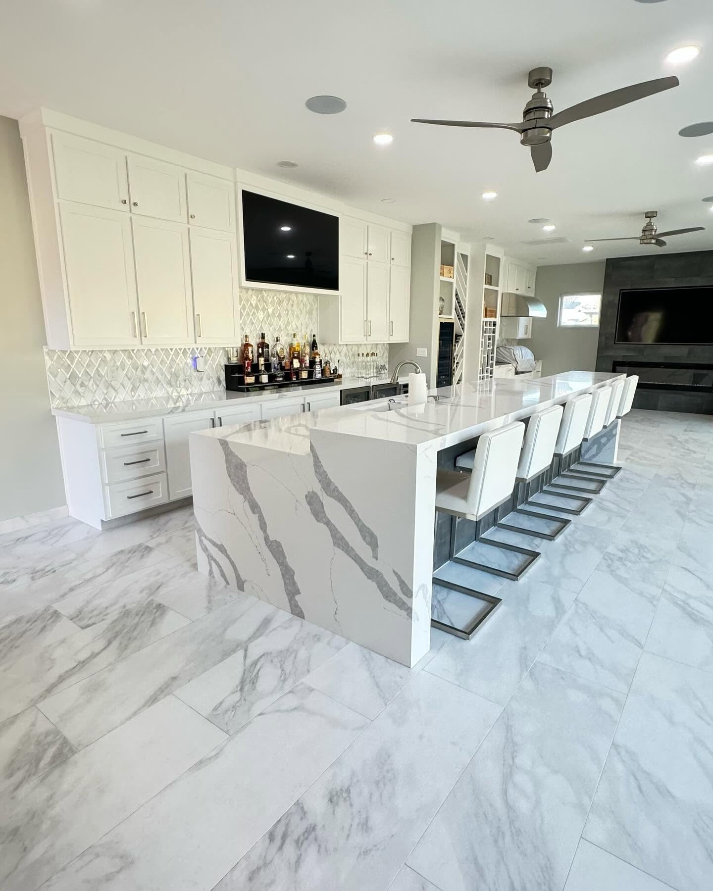 Marble waterfall island with bar seating